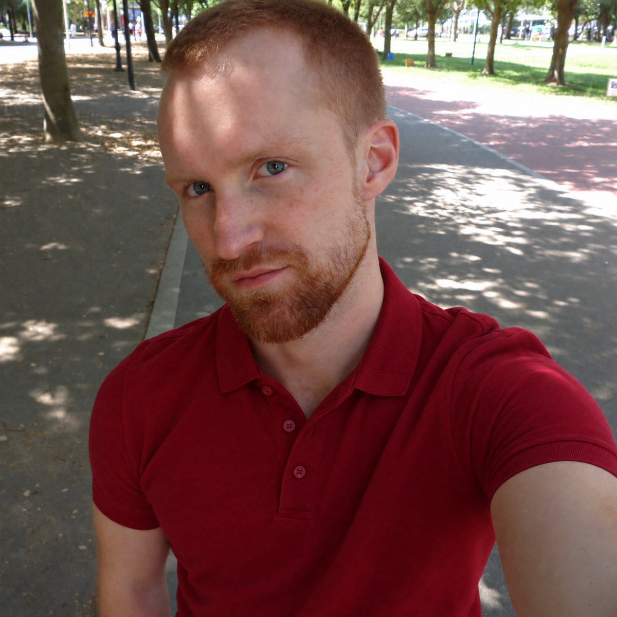 Selfie in a park wearing the red Bleamme Short Sleeve Polo